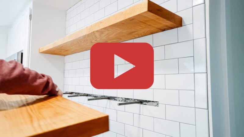 placing floating shelves over tile in kitchen with playback icon