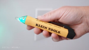 hand holding electrical tester tool