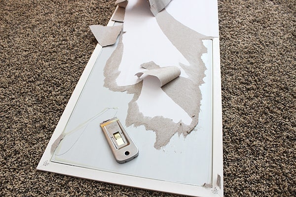 removing the paper from the back of a cheap mirror