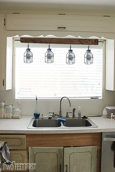 Install A Sconce Light Above The Kitchen Sink