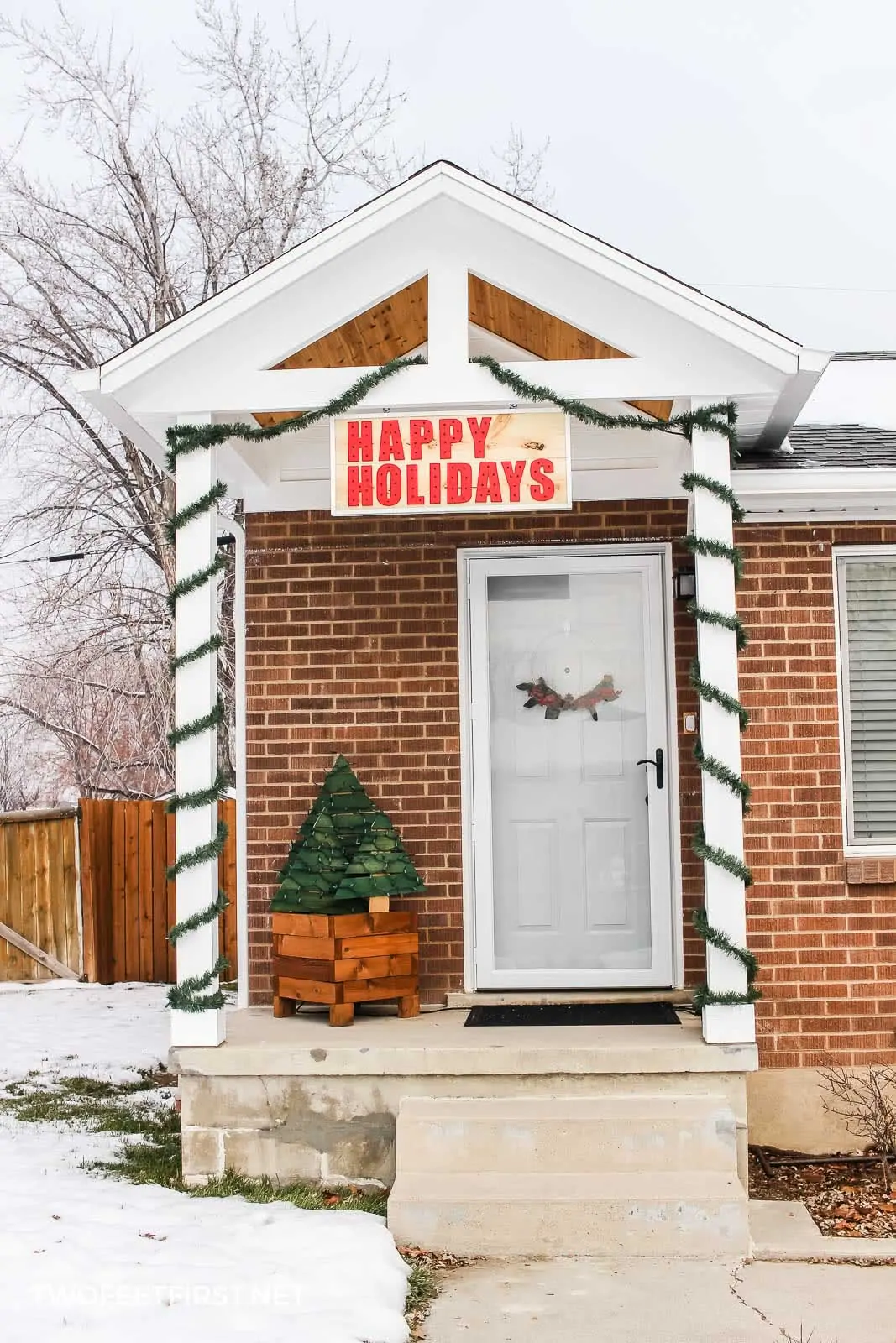 decorate porch with Happy Holidays sign