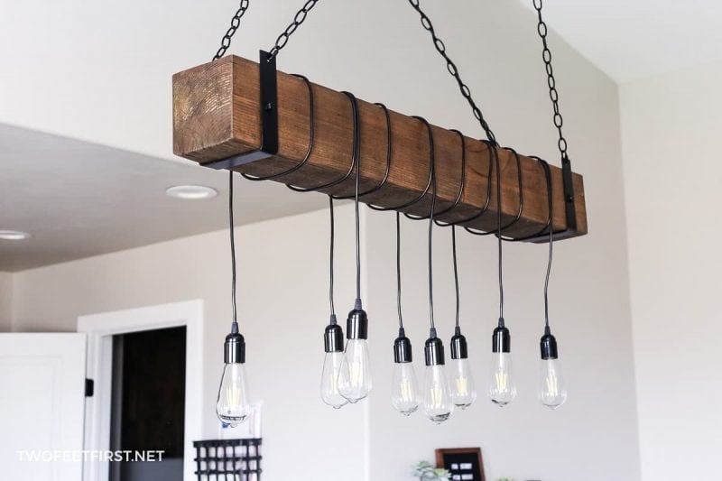 build a wood beam light fixture with black lights hanging from beam