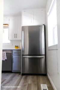 fridge with white cabinet surround