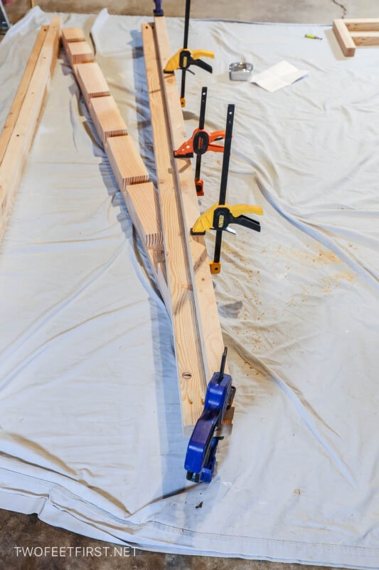 clamps holding wood to attach to make mattress rail