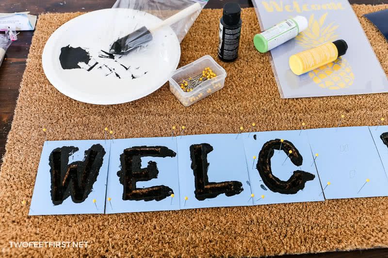 painting black letters for welcome doormat