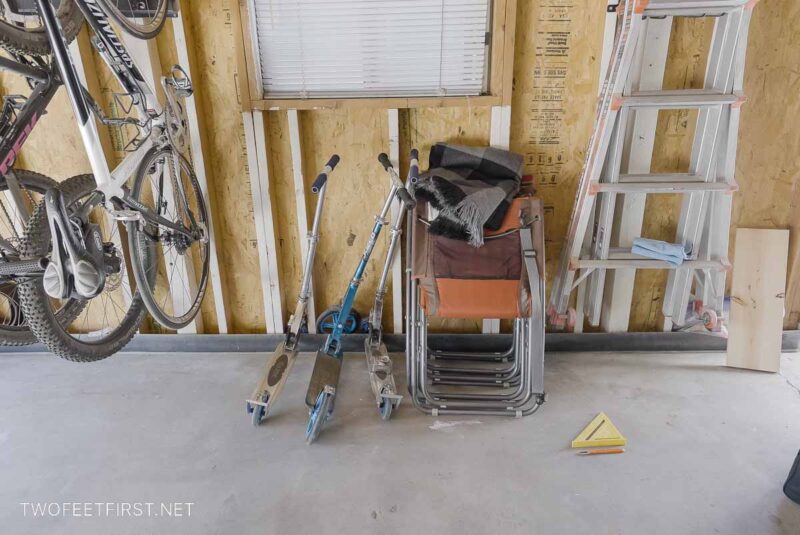 Scooters laying in garage without scooter stand