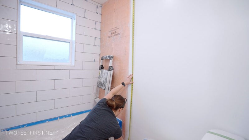 measuring for tile trim on bathroom wall
