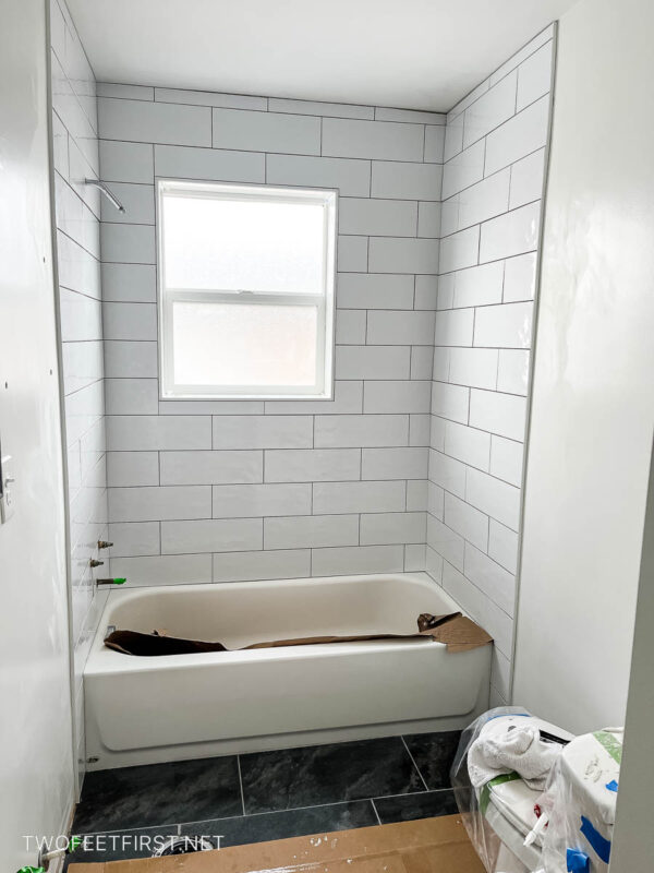 full bathroom Surround with white subway tile
