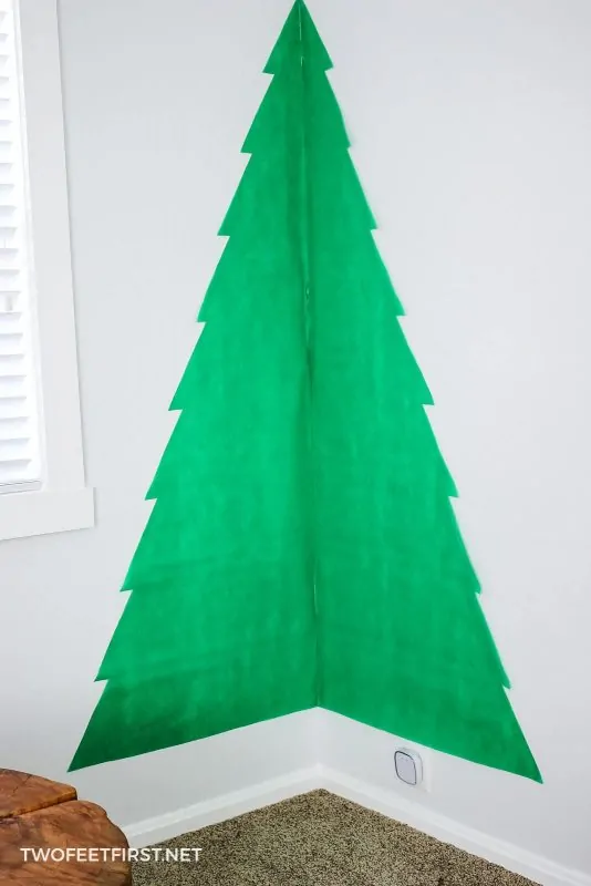 add fabric to wall for Christmas tree
