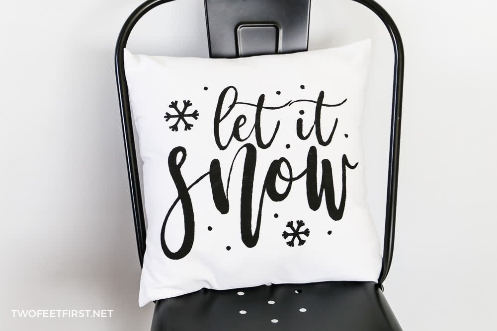 Christmas pillow with 'let it snow'.