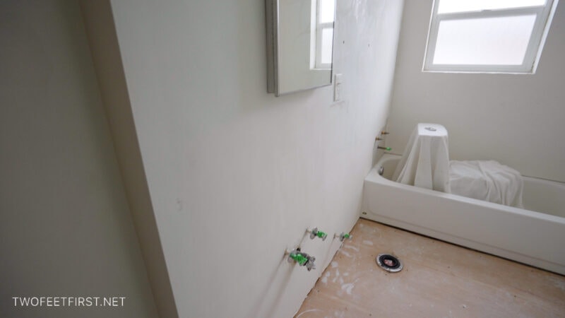 bathroom wall after repairing with plaster of paris