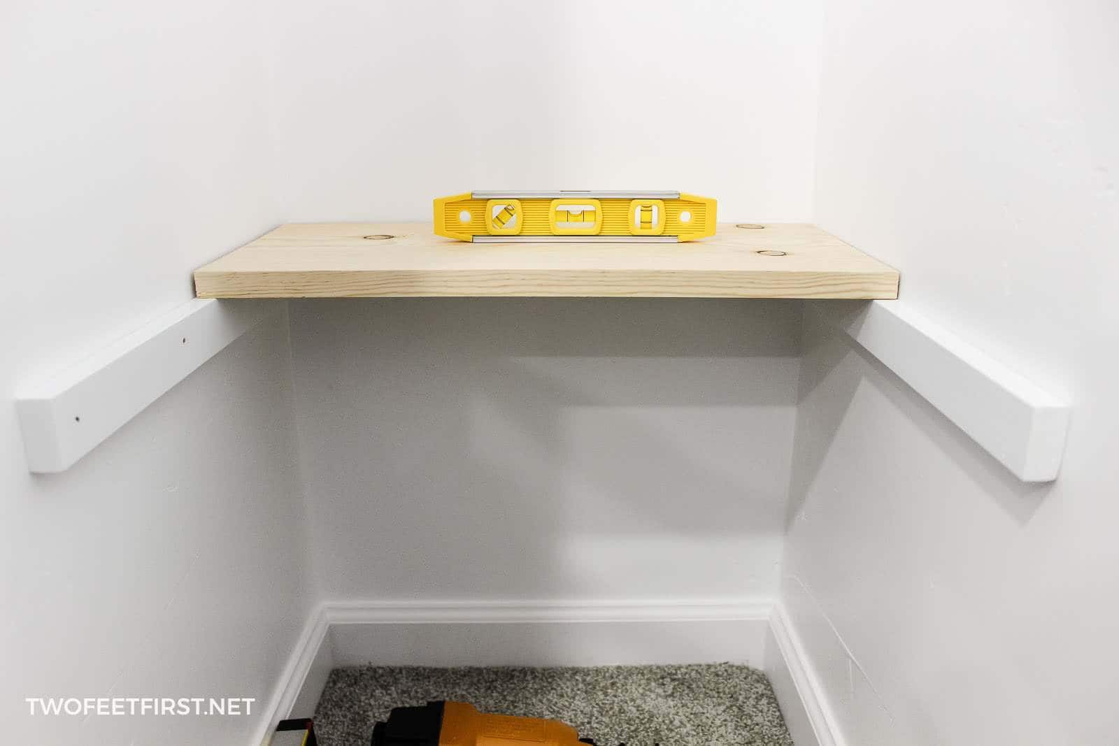 Build a simple wall to wall shelves TwoFeetFirst