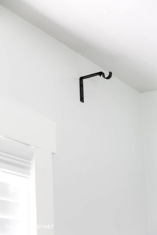 hang curtain rod brackets onto drywall