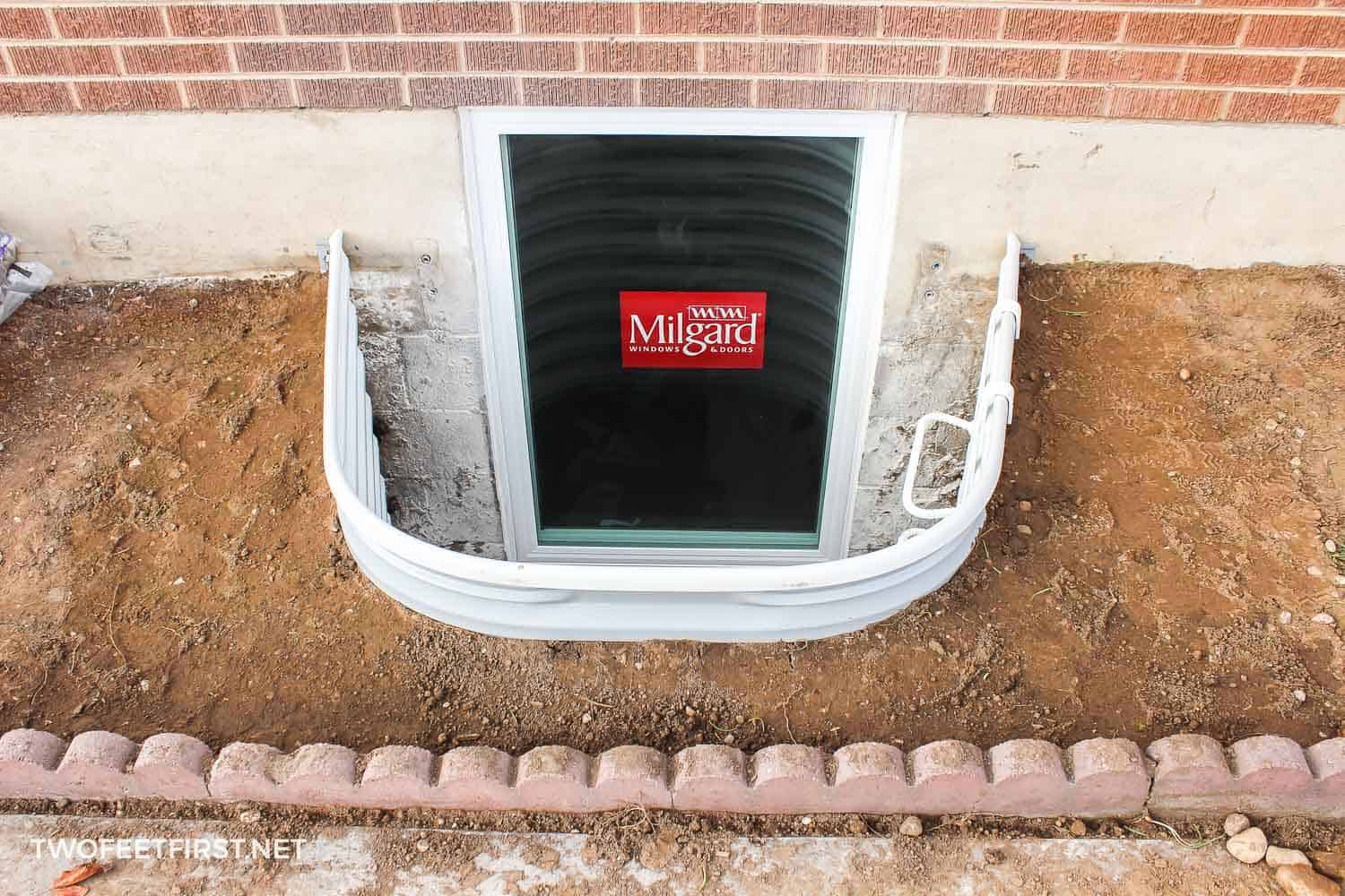 The process of installing window wells for a basement