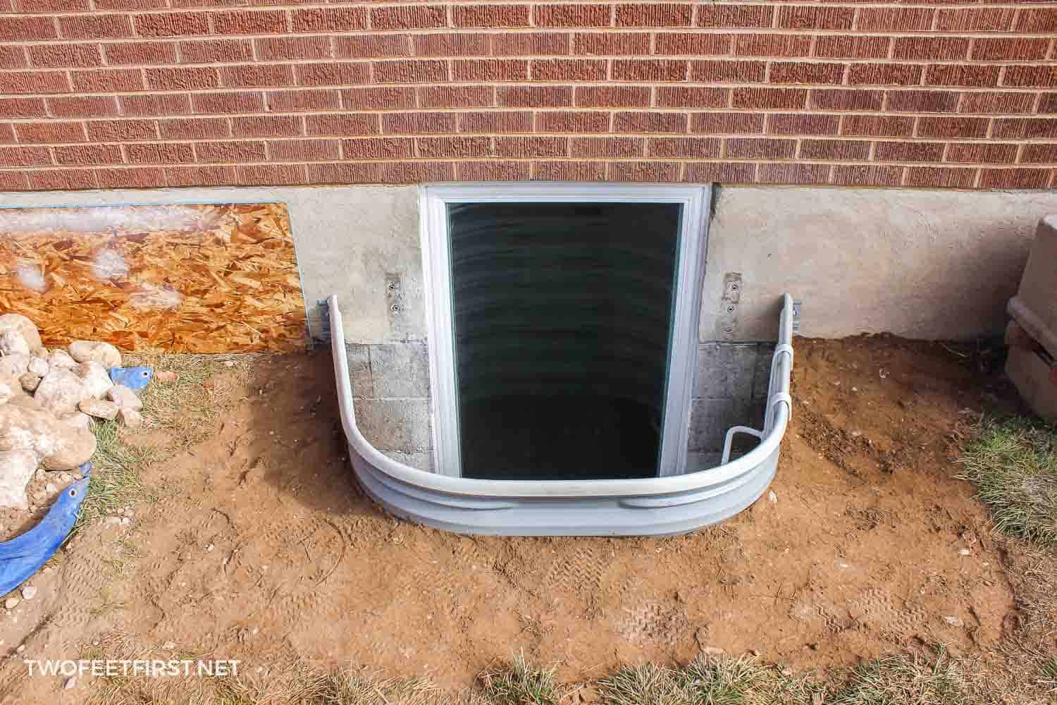 The process of installing window wells for a basement