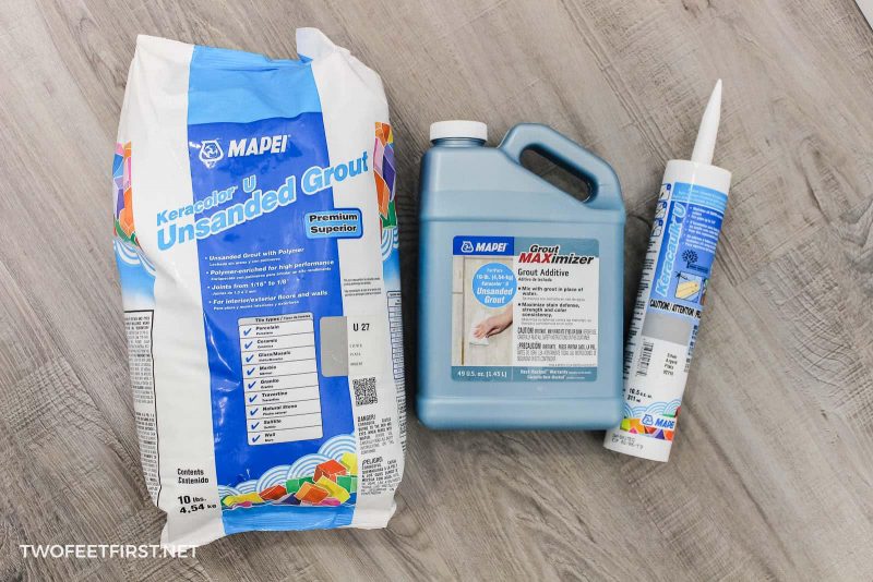 supplies for applying grout to tiled shower