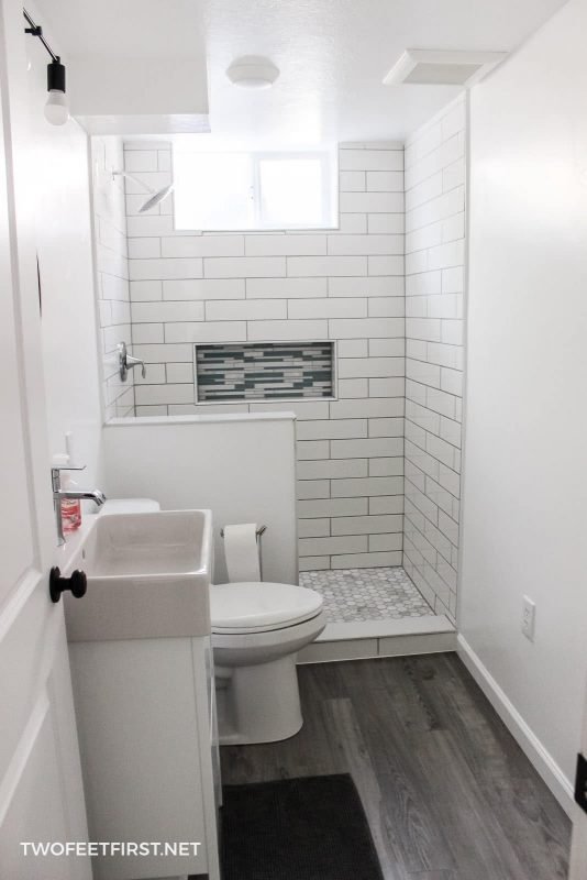 tiled shower with white subway and hexagon marble 