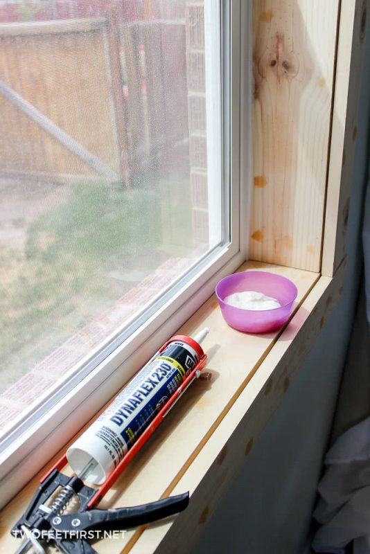 apply sealant onto window casing